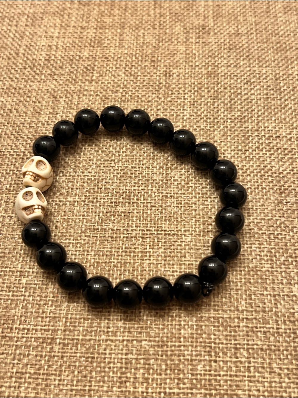 Men's Black Bead Bracelet with Ivory Skull Accents